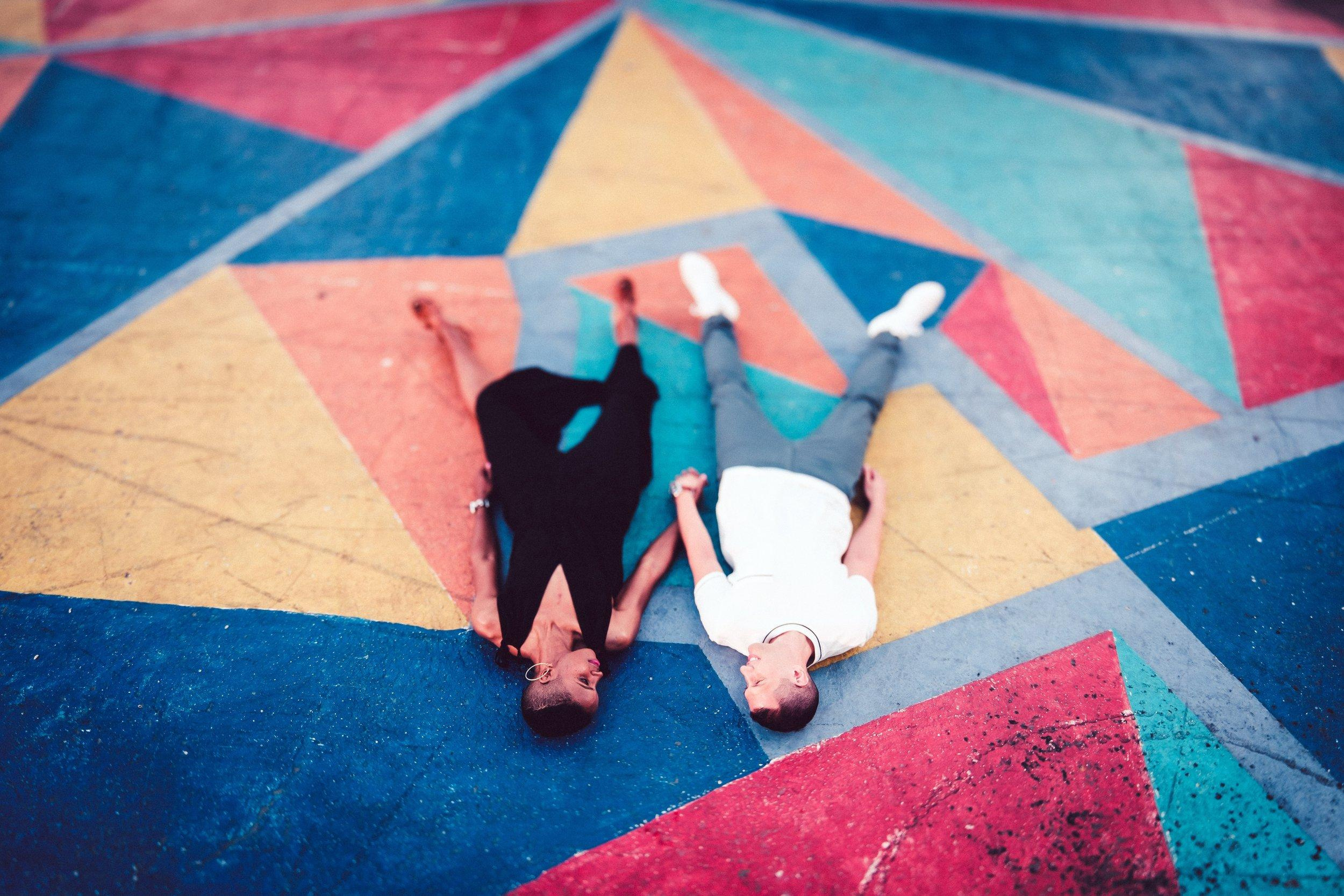 colorful street mural, diverse couple