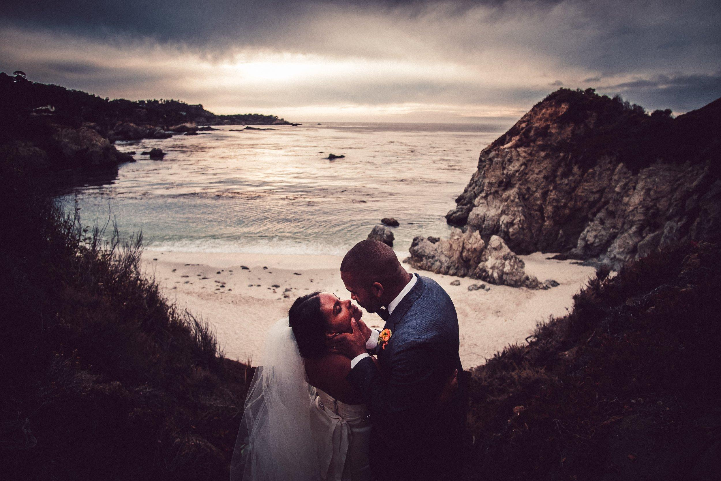 African American couple at Point lobos Gibson's beach, California sunset, Pacific Ocean