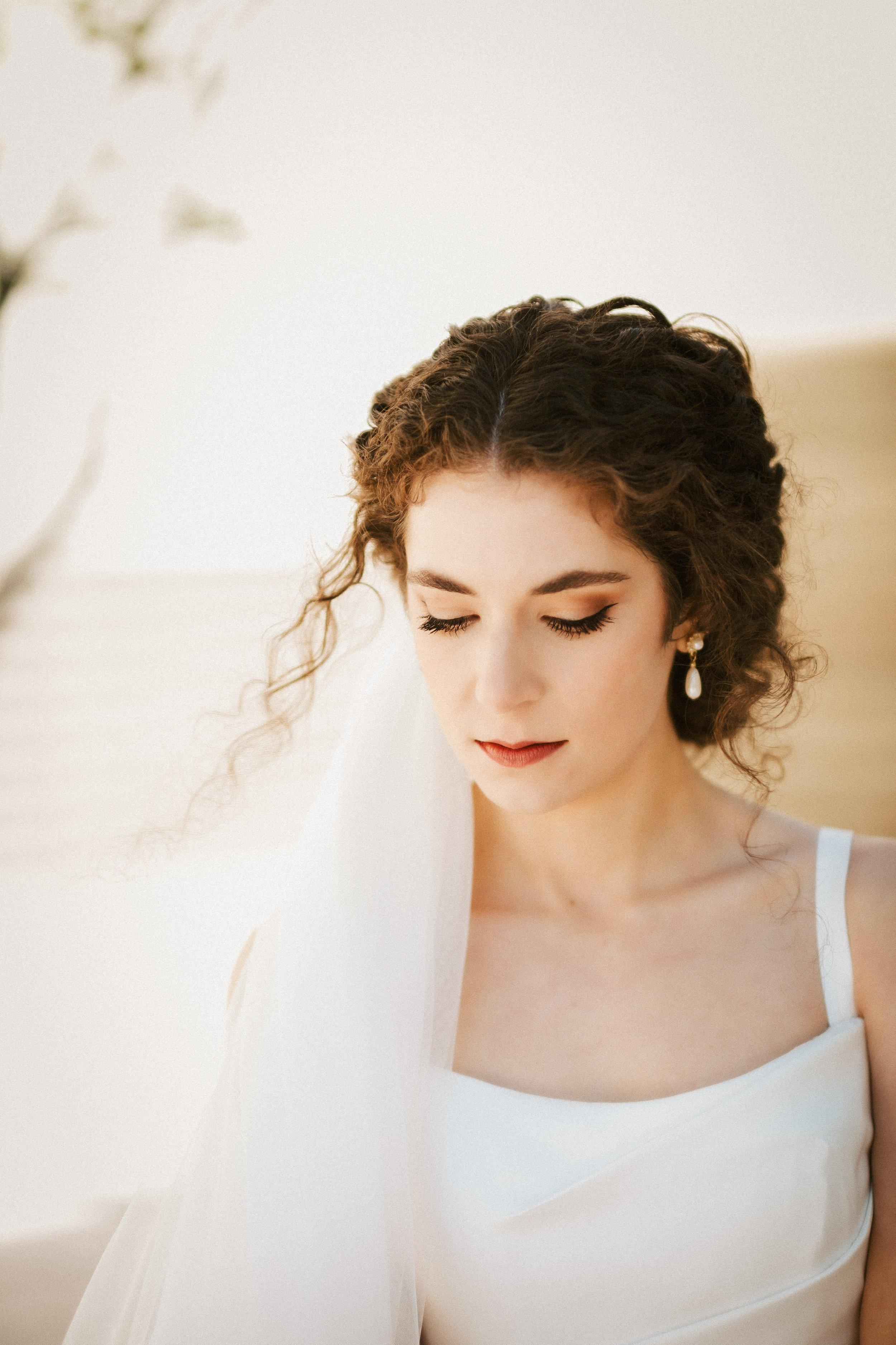 curly haired bride portrait