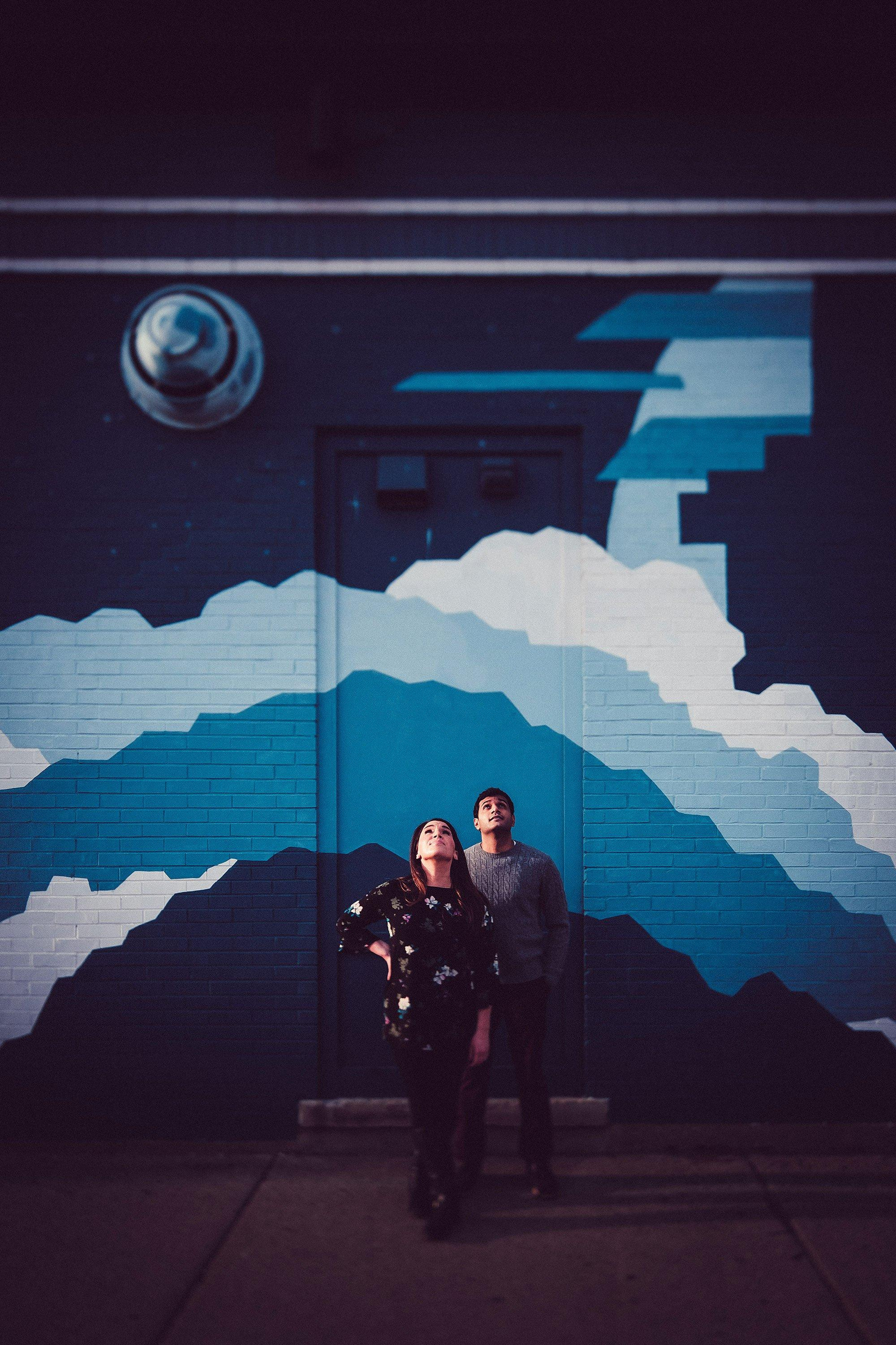 engaged indian couple, blue mural