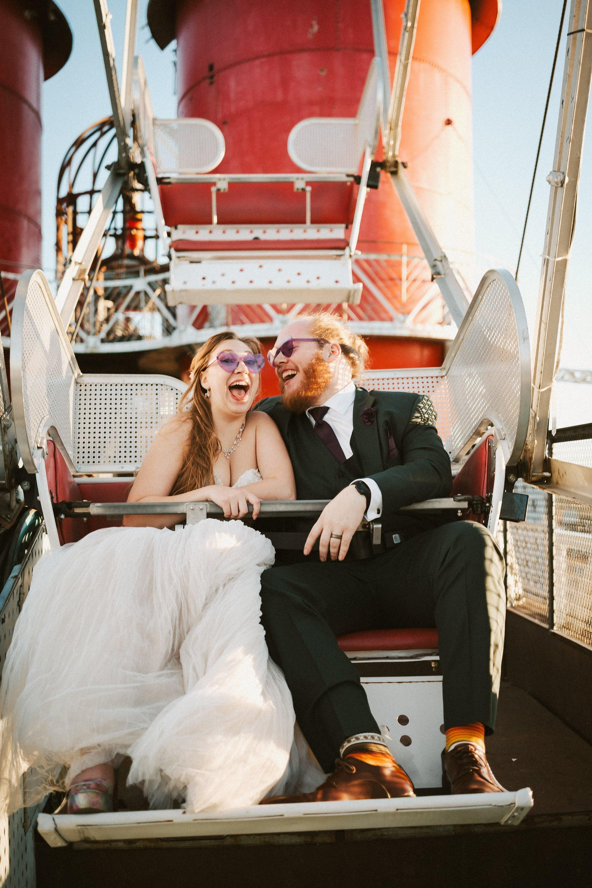 bride and groom on Ferris wheel