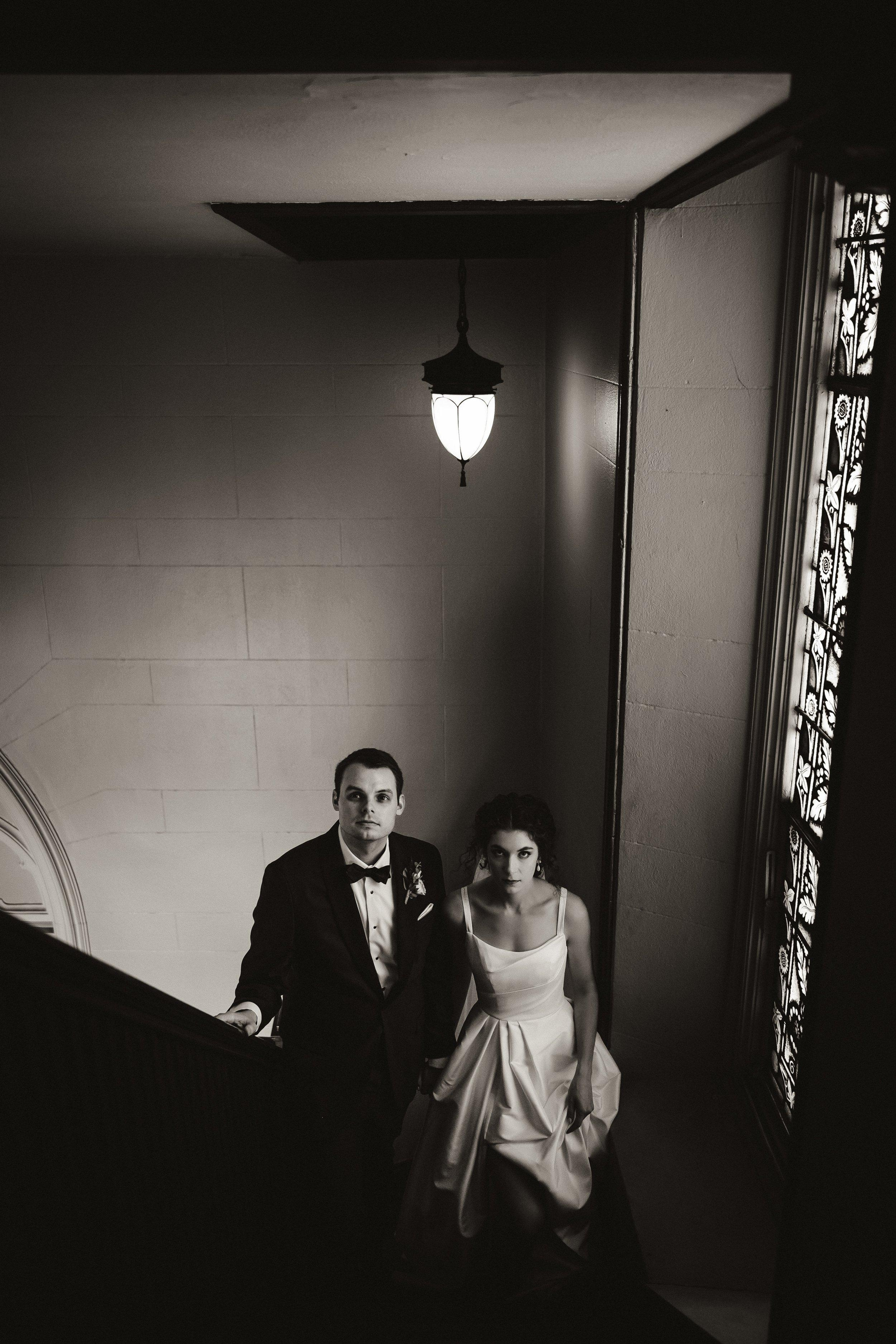 bride and groom in church loft stairs